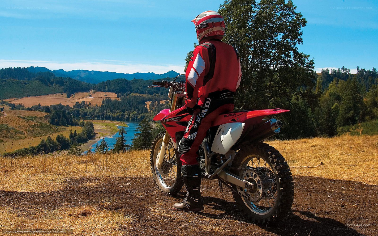 Motorcyclist overlooking river valley