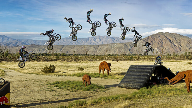 Motorcyclist Performing Jump — Blue