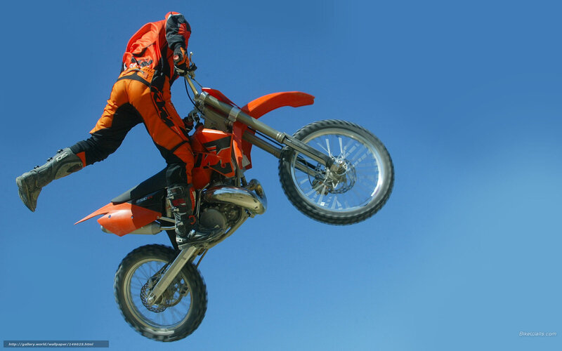 Motorcyclist Performing Stunt — Orange