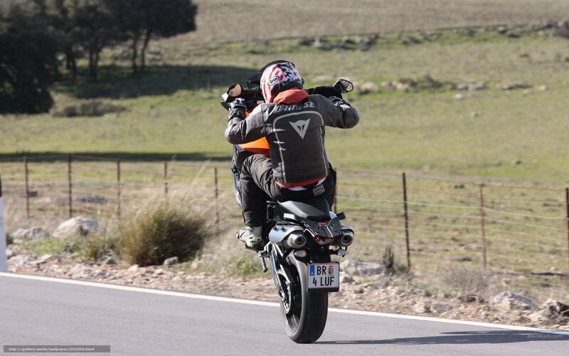 motorcyclist performing wheelie
