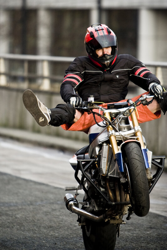Motorcyclist performing wheelie