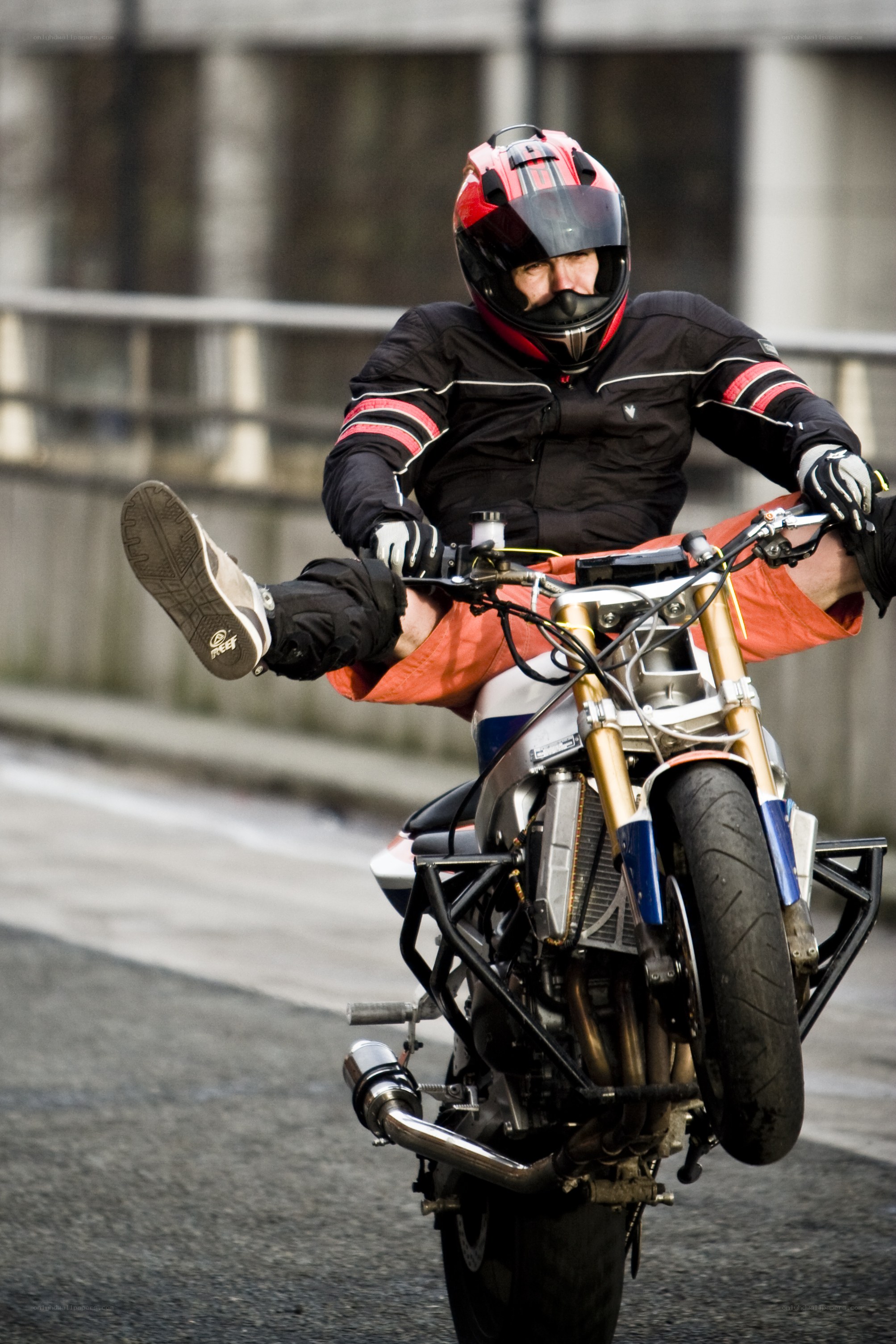 Motorcyclist performing wheelie