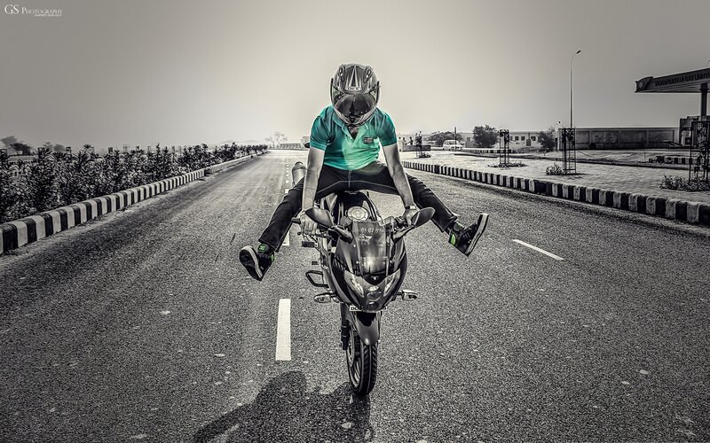 motorcyclist performing wheelie