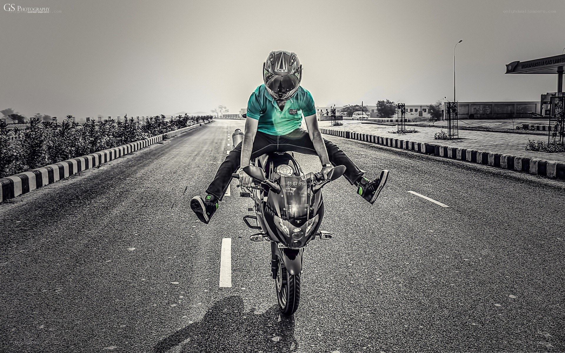 motorcyclist performing wheelie