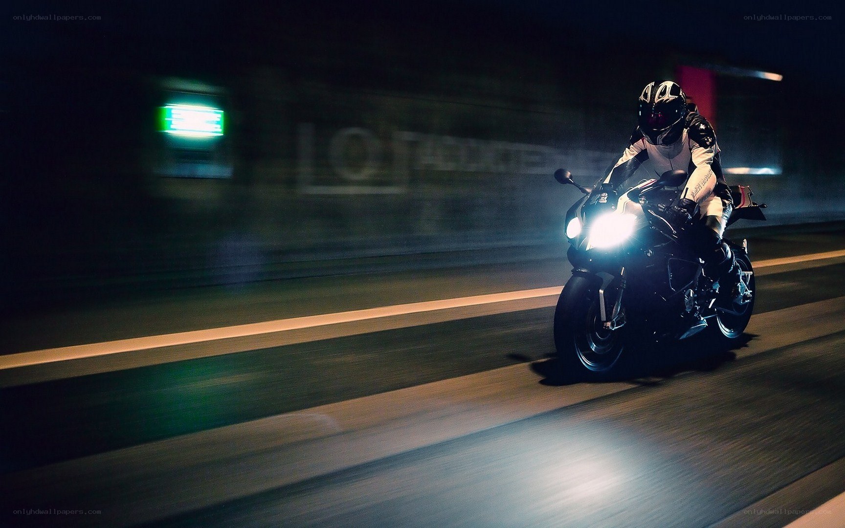 Motorcyclist riding at night