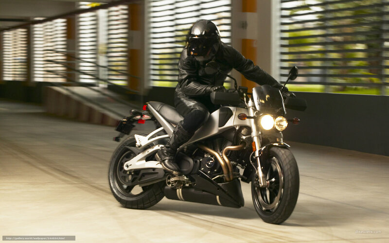 motorcyclist riding in parking garage