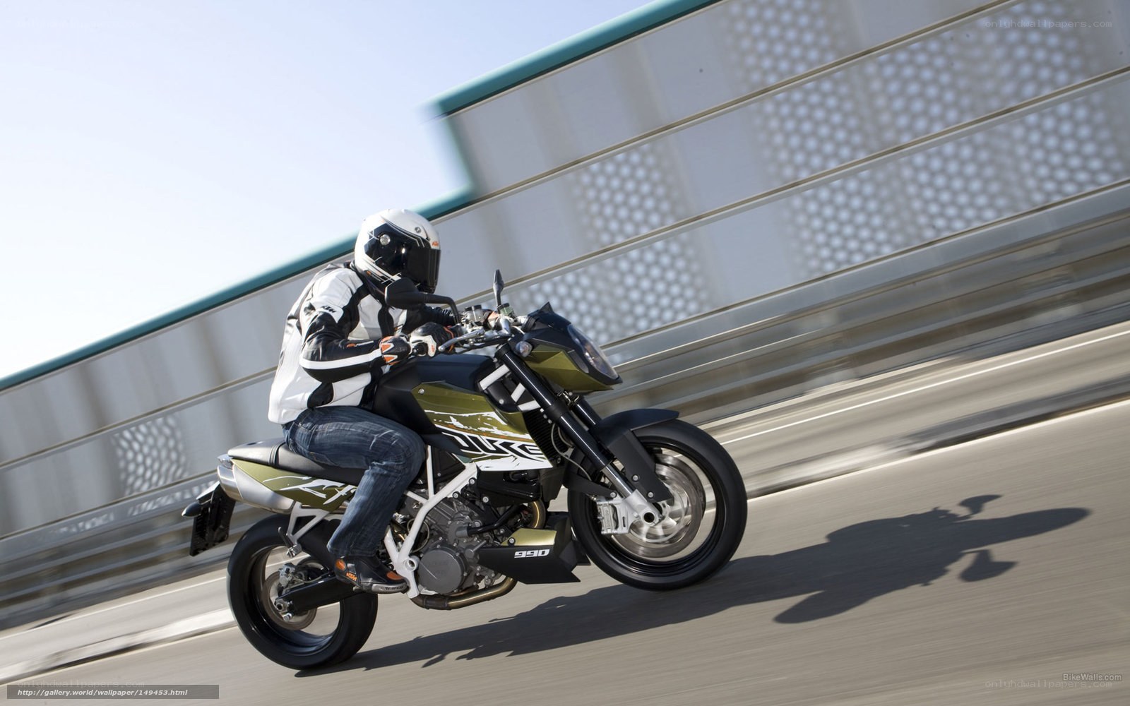 motorcyclist riding on a bridge