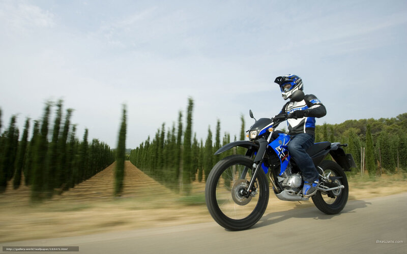 Motorcyclist riding on a country road