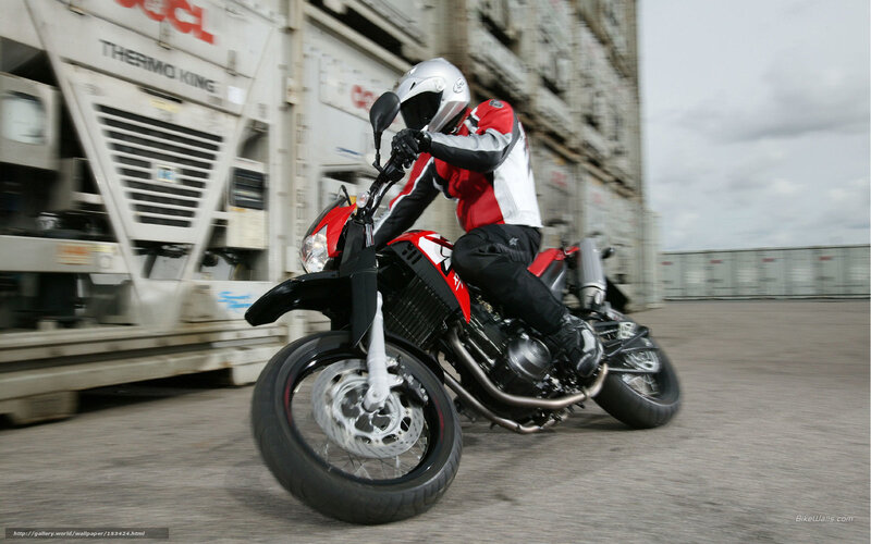 motorcyclist riding on a dock