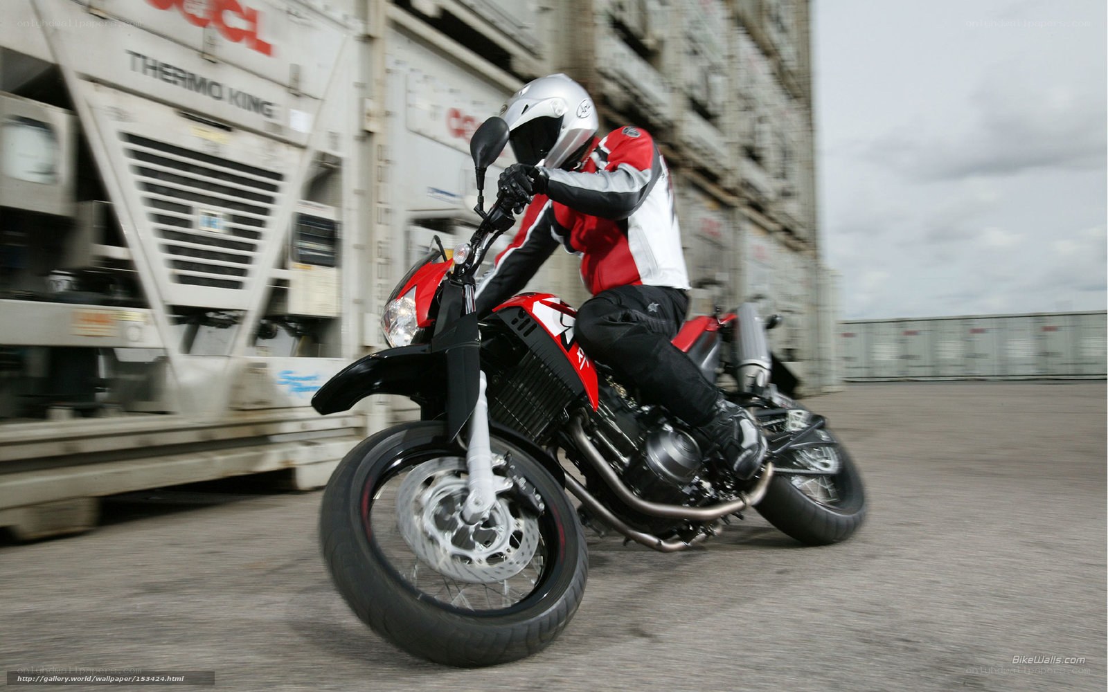 motorcyclist riding on a dock