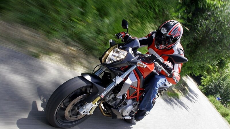 motorcyclist riding on a road