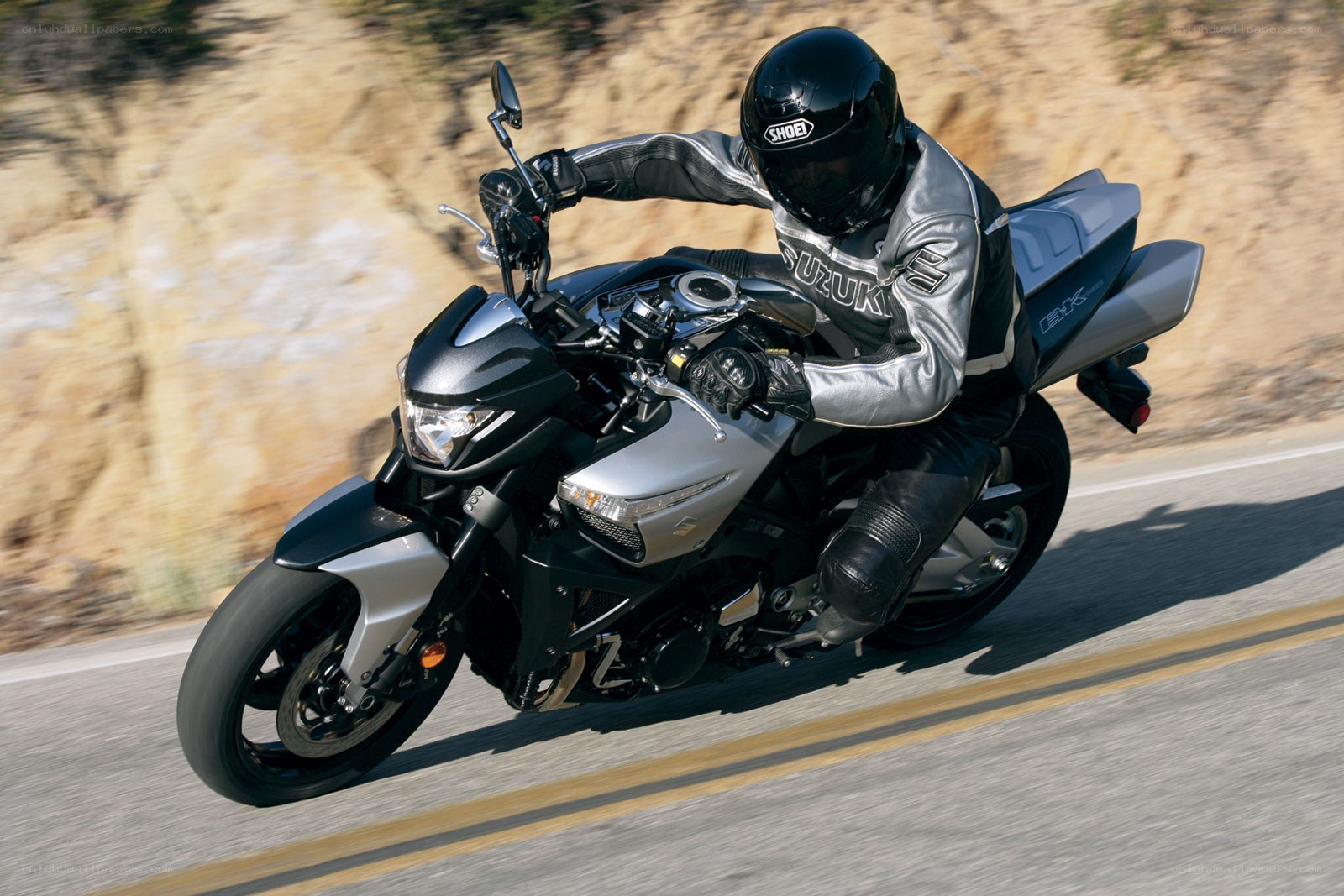 motorcyclist riding on a road