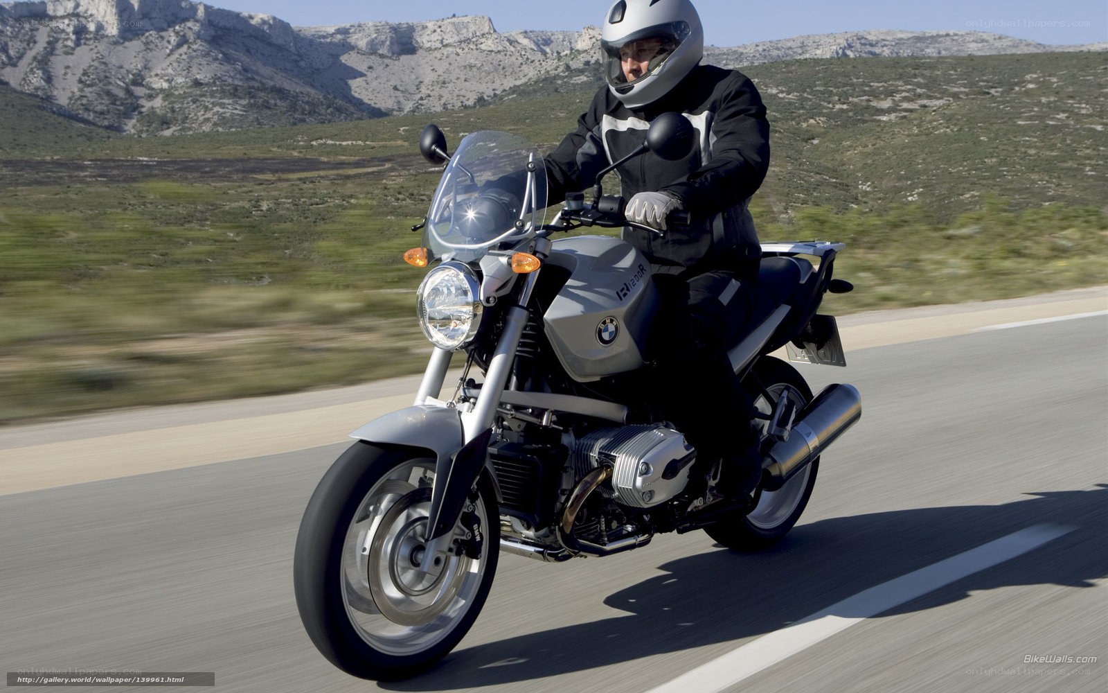 motorcyclist riding on a scenic road