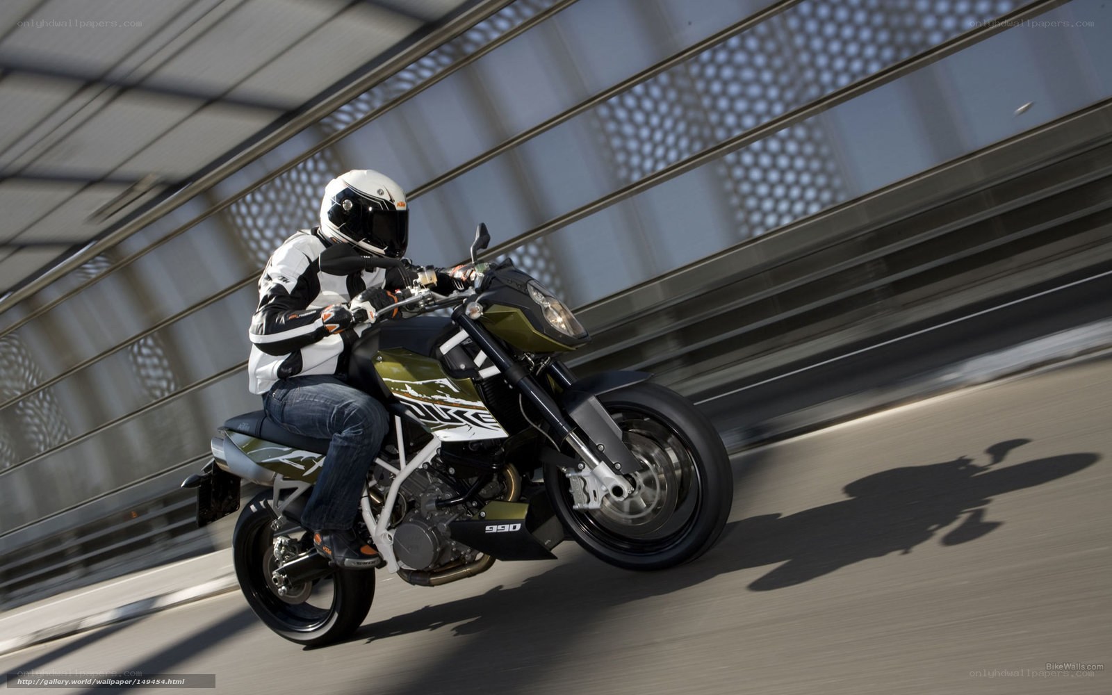 motorcyclist riding on bridge