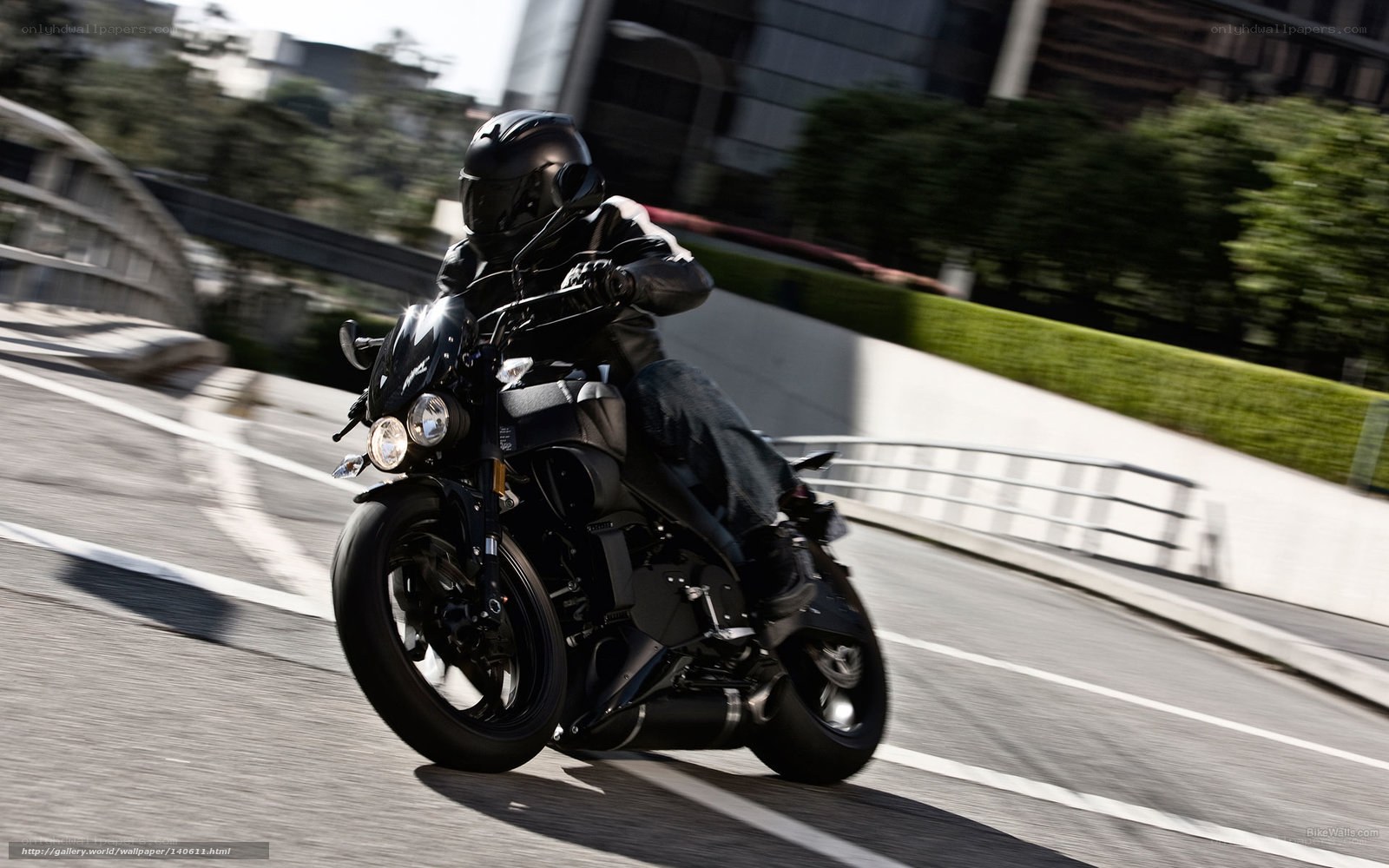 motorcyclist riding on city road