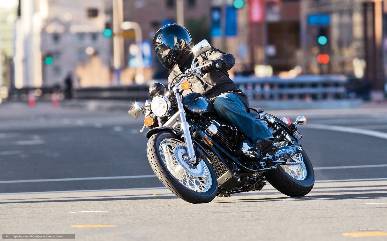 Motorcyclist riding on city street