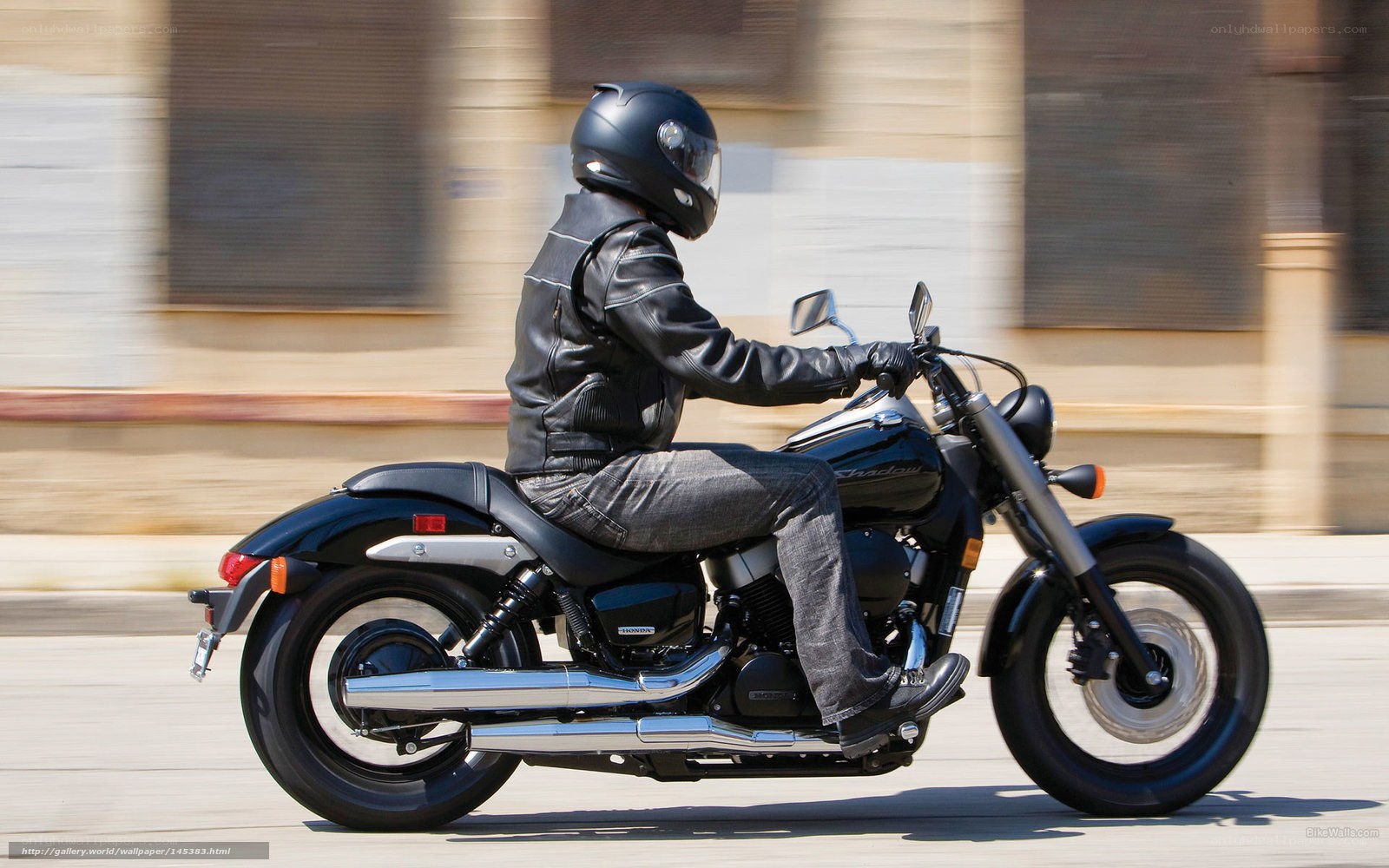 Motorcyclist riding on city street
