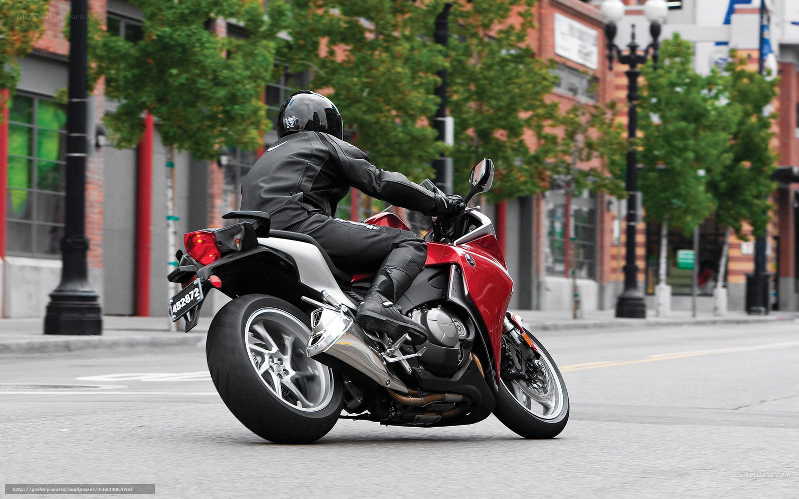 motorcyclist riding on city street
