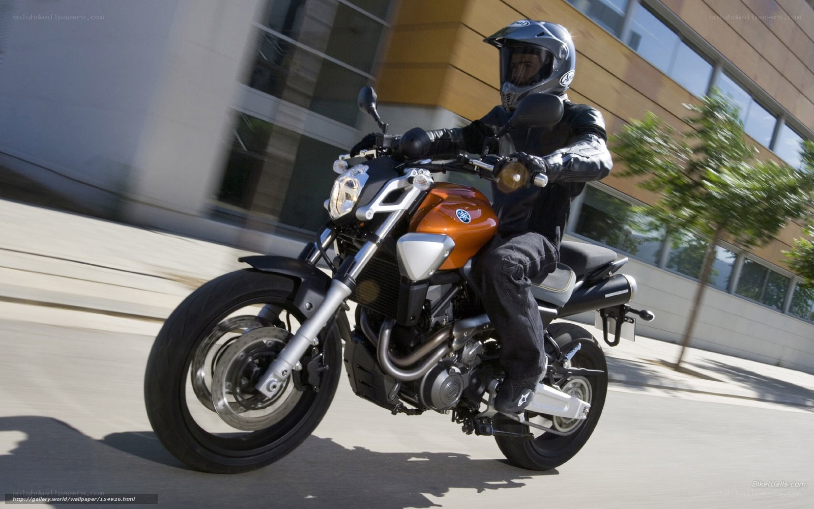 motorcyclist riding on city street