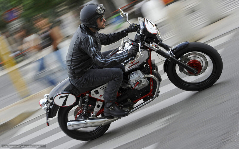 Motorcyclist riding on city street