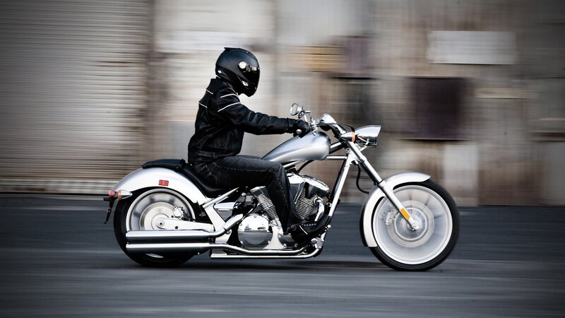 motorcyclist riding on city street