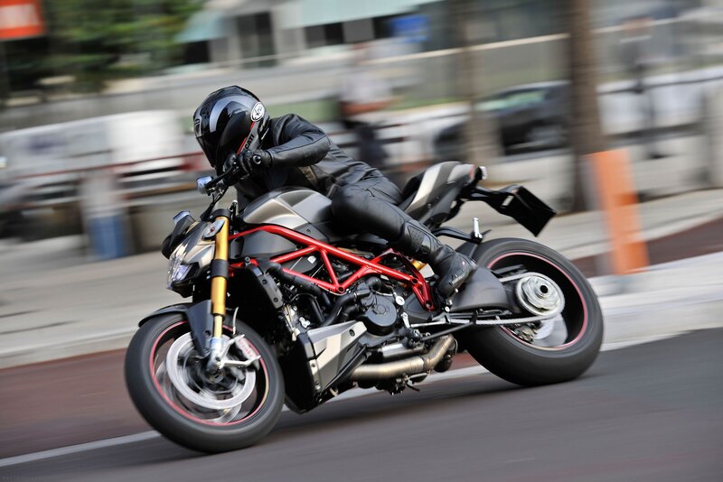 motorcyclist riding on city street