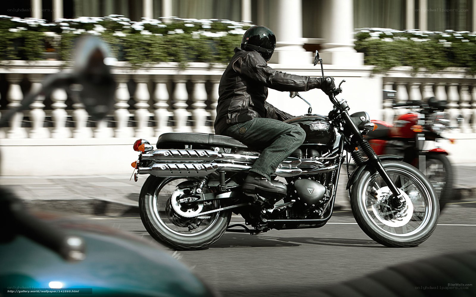 Motorcyclist riding on city street