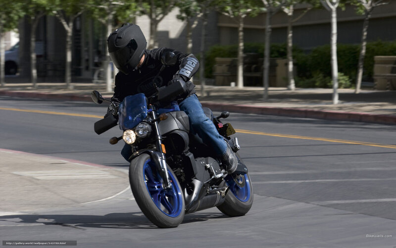 Motorcyclist riding on city street