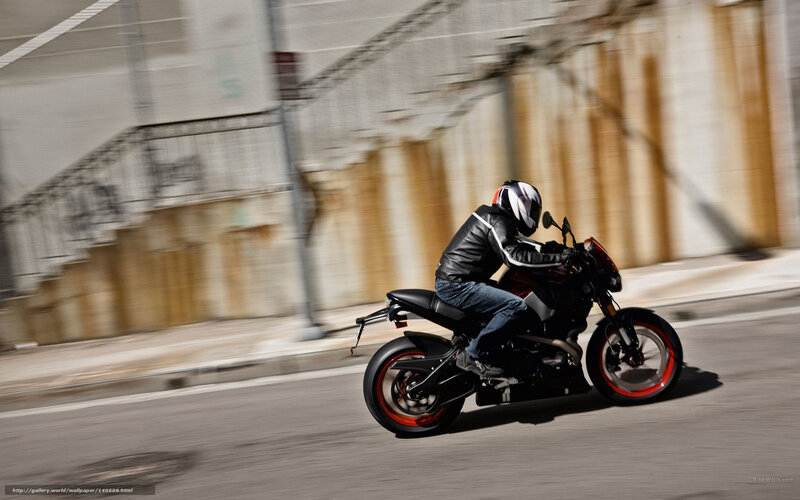 motorcyclist riding on city street