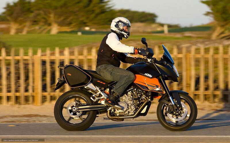 motorcyclist riding on coastal road