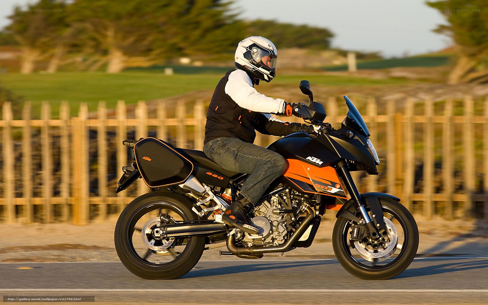 motorcyclist riding on coastal road