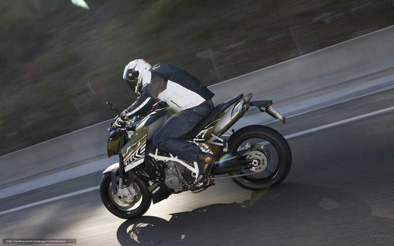 motorcyclist riding on highway