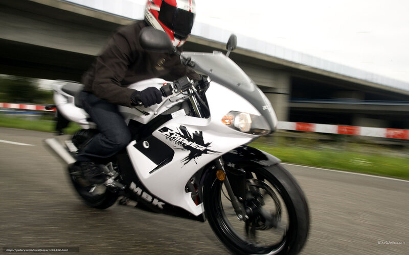 motorcyclist riding on highway