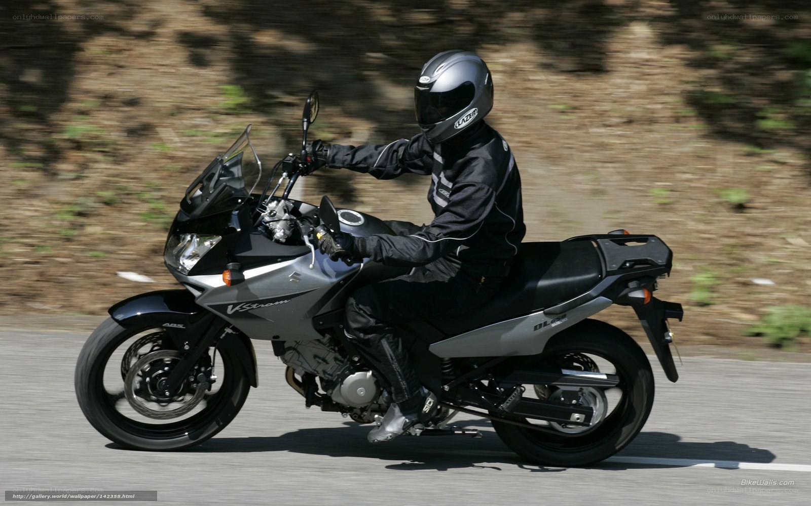 motorcyclist riding on road
