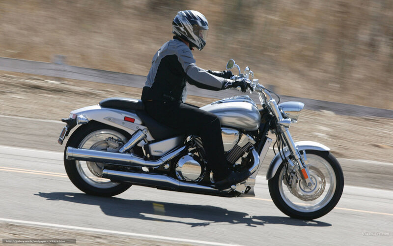 motorcyclist riding on road