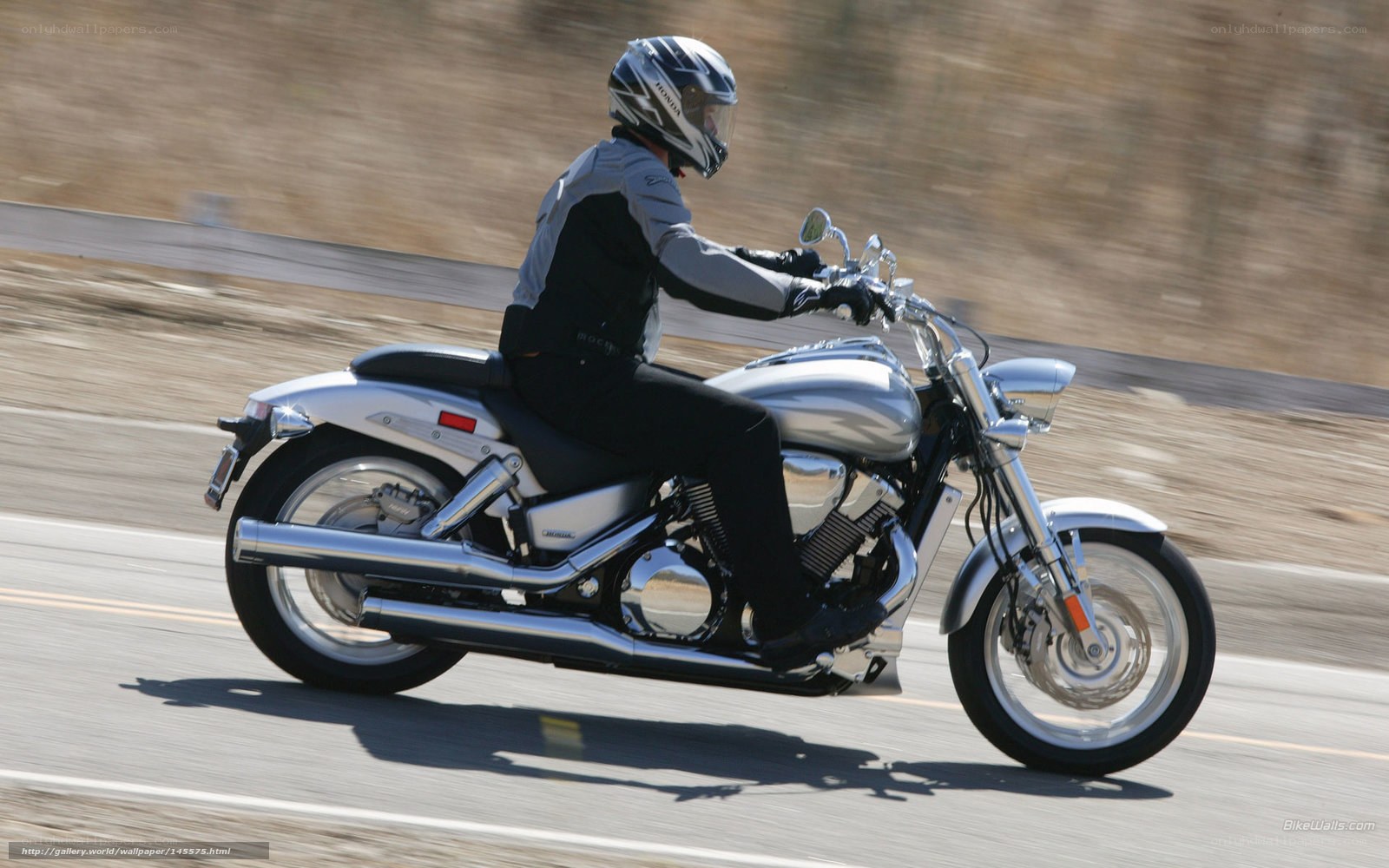 motorcyclist riding on road