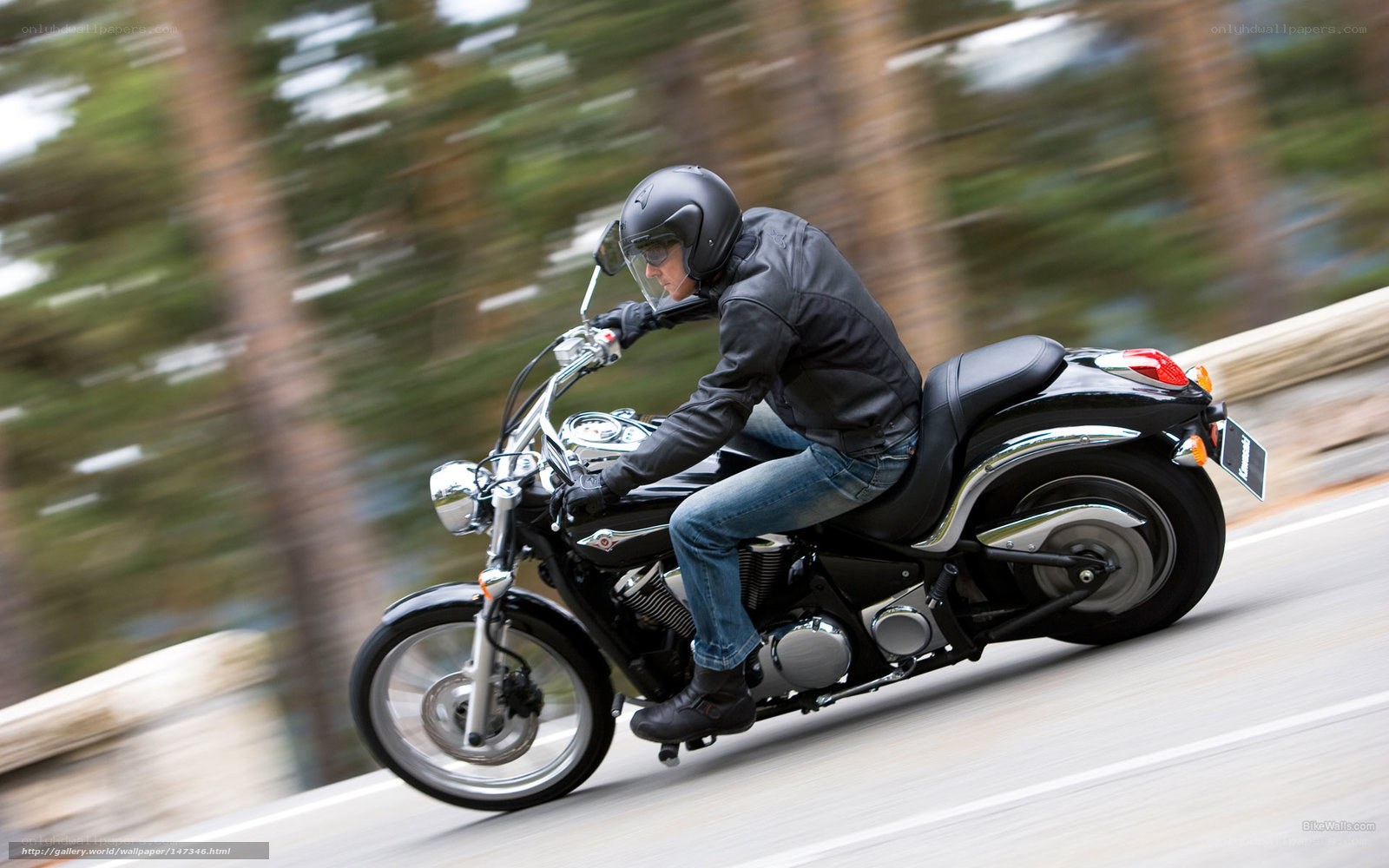 motorcyclist riding on road