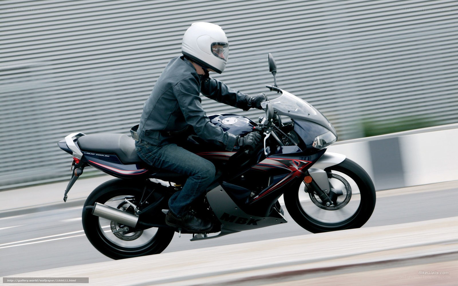 motorcyclist riding on road