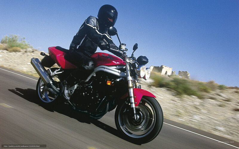 motorcyclist riding on road