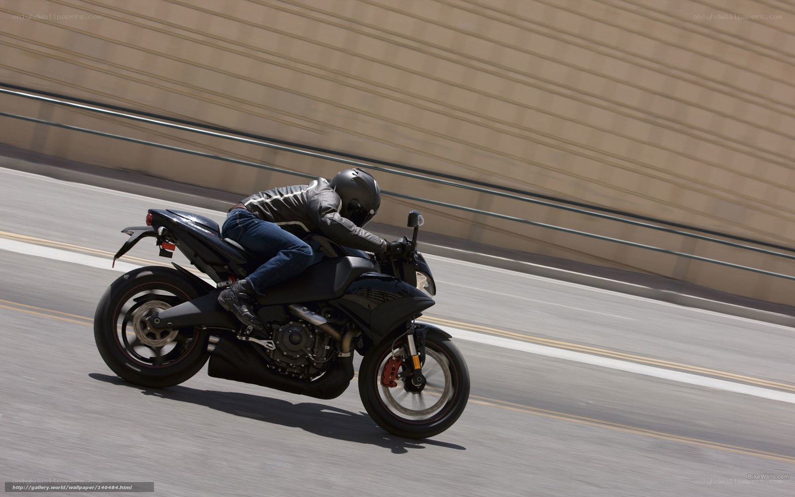 motorcyclist riding on road