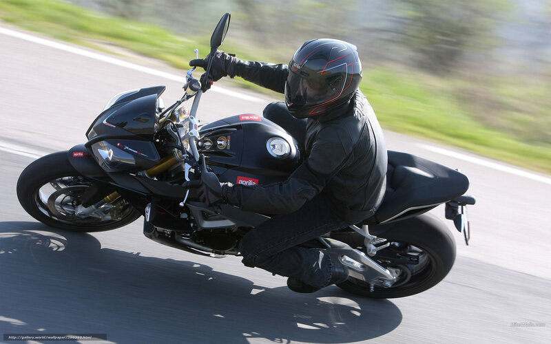 motorcyclist riding on road