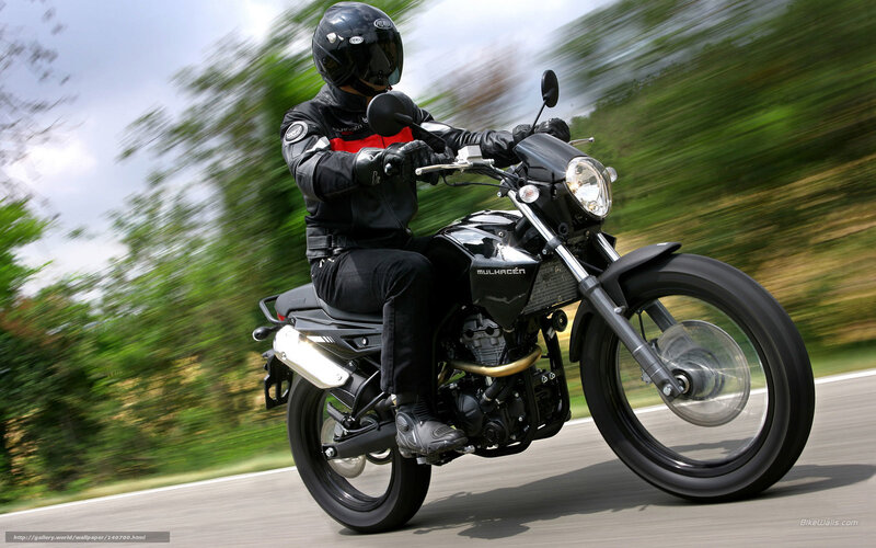 motorcyclist riding on road