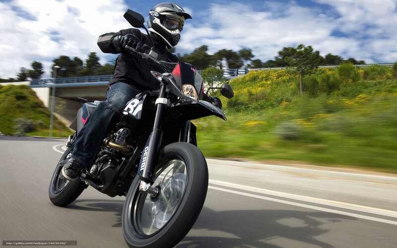 motorcyclist riding on road
