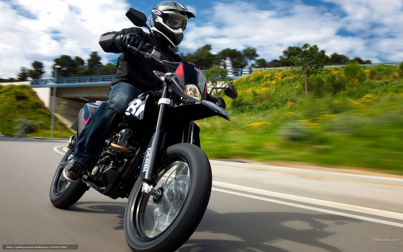 motorcyclist riding on road