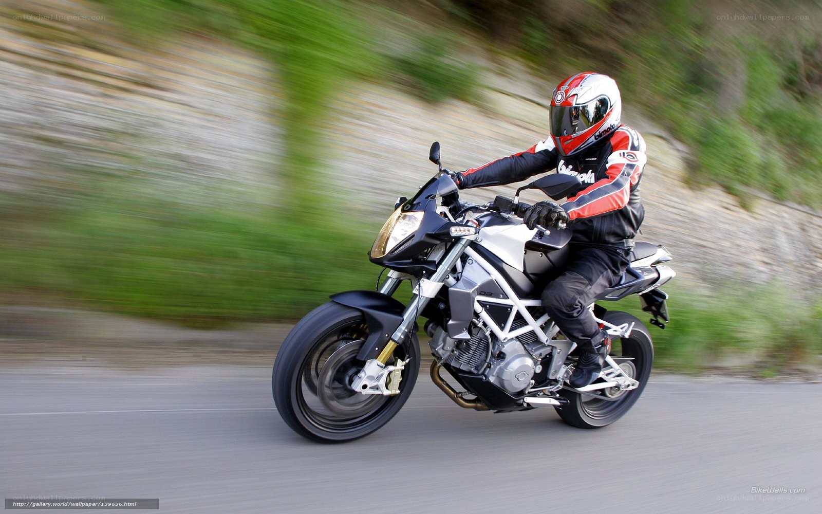 motorcyclist riding on road