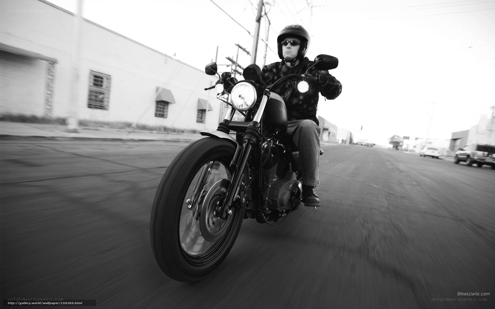 motorcyclist riding on street