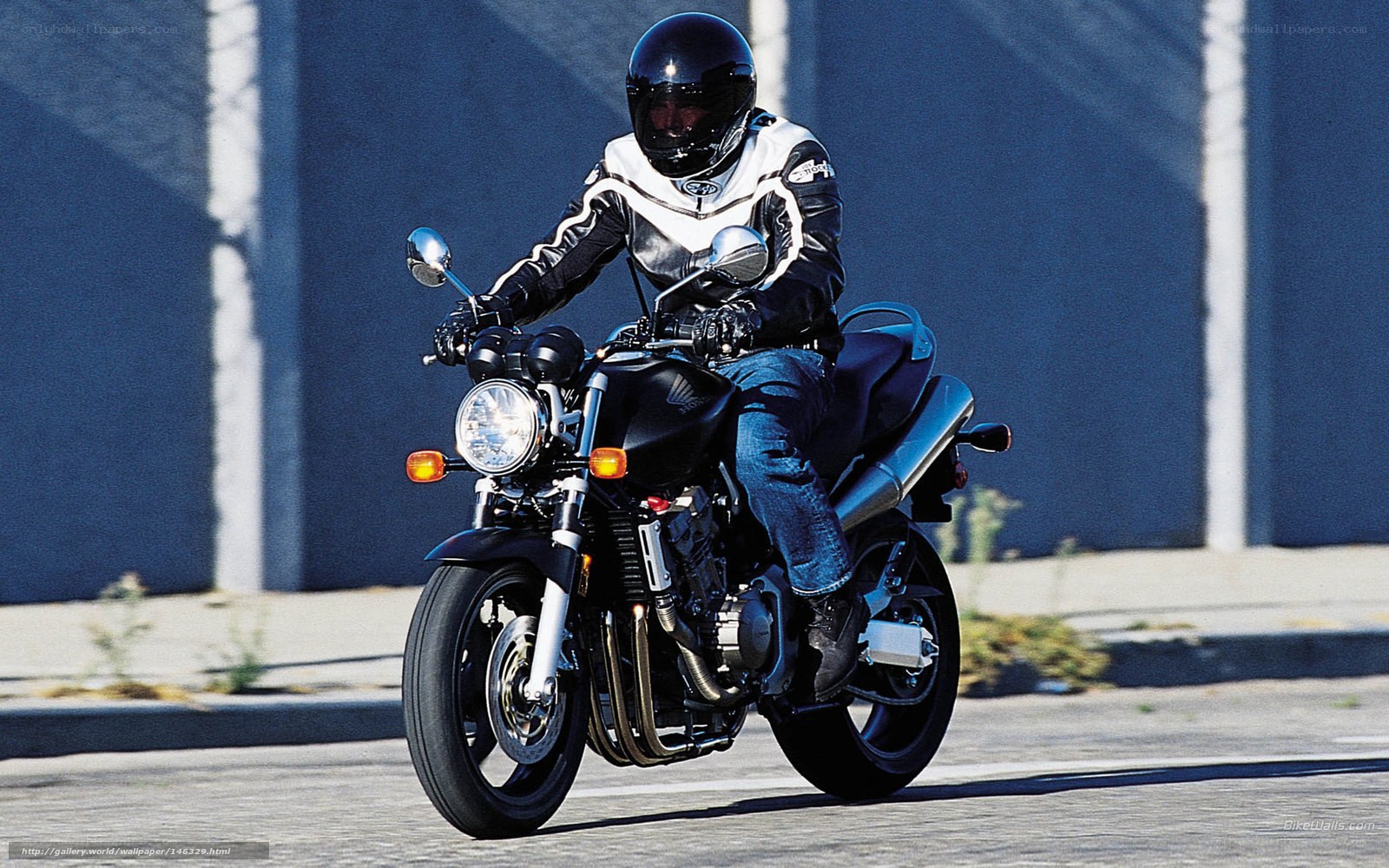 motorcyclist riding on street