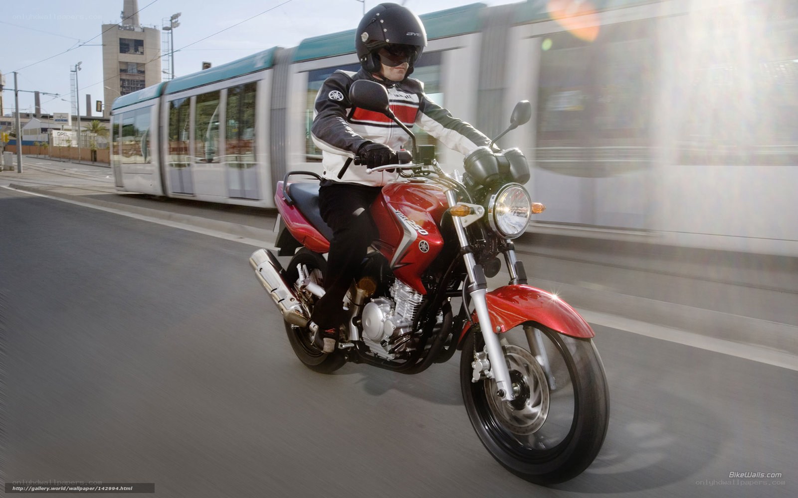Motorcyclist riding red bike