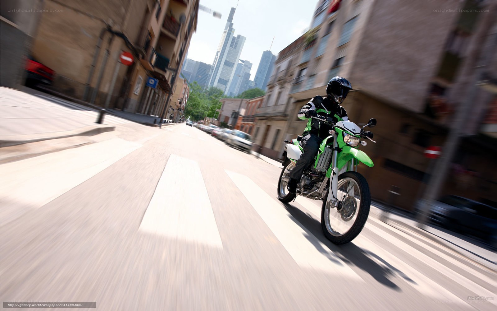 Motorcyclist riding through city
