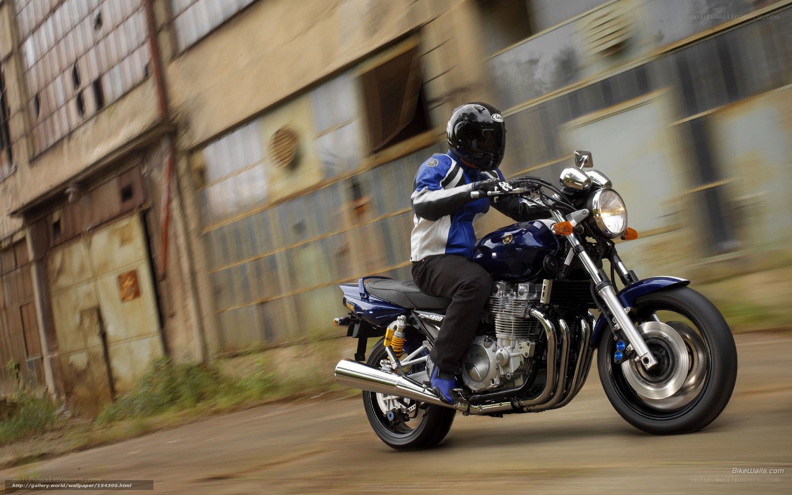 motorcyclist riding through urban area